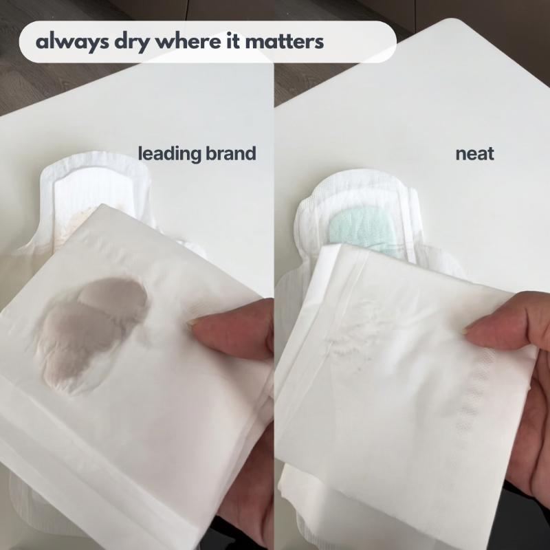 Comparison of dryness of two menstrual pads, labeled 'leading brand' and 'neat'.